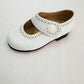 Zapato blanco con broche
